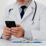 doctor-using-his-phone